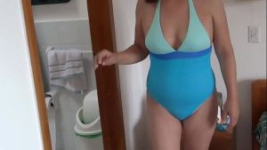 Stepmom at the beach, puts on a bikini, shows off, masturbates, and urinates