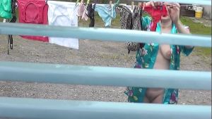 MILF naked in public. Frinas husband watches through window as a pregnant neighbor without panties and a bra dries clothes in courtyard of house. Voyeur. Peeping. Public nudity. Outdoors POV