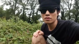 Cute French-Asian gay twink jerks off his shaved cock outside cums thick cum sticking to his fingers