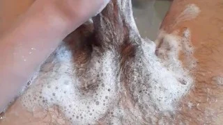 Extremely horny teen washes his dirty cock with shampoo in the bathtub