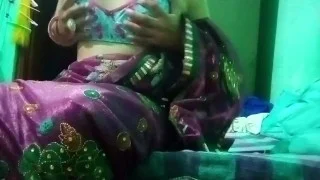 Indian Gay Crossdresser in pink saree pressing and milking his boobs so hard and enjoying the hardco