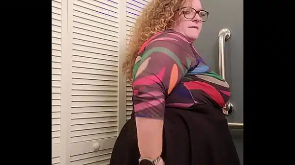 redhead bbw receptionist bends over and invites you up her skirt